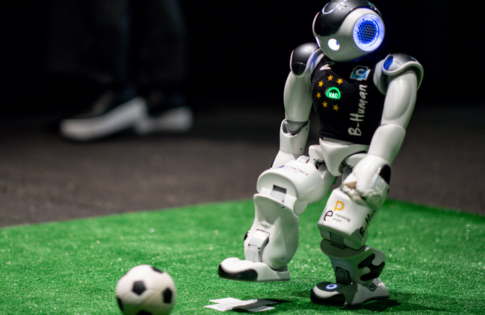 Robots take part in AI-powered football game in China